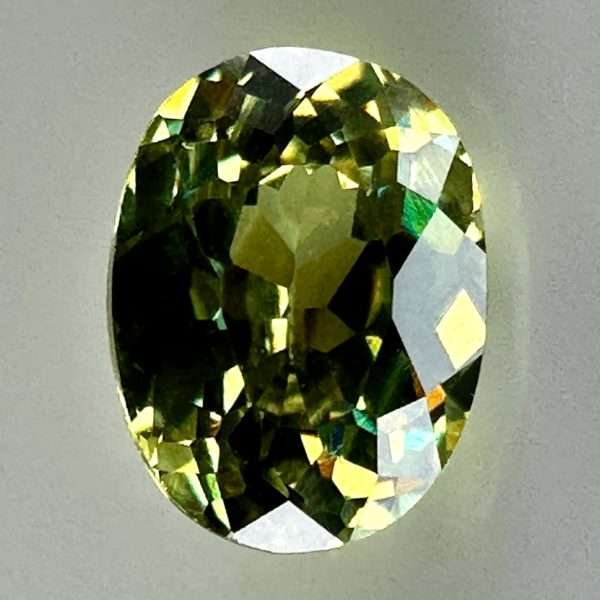 0.46 carat natural demantoid garnet from Namibia, bright green color, eye-clean clarity, and exceptional brilliance.