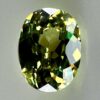 0.46 carat natural demantoid garnet from Namibia, bright green color, eye-clean clarity, and exceptional brilliance.