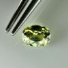 0.46 carat natural demantoid garnet from Namibia, bright green color, eye-clean clarity, and exceptional brilliance.