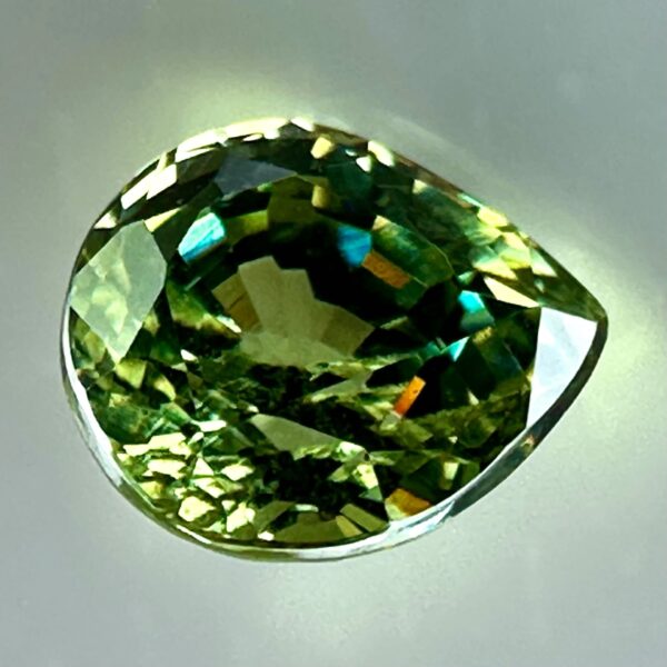 0.43 carat natural demantoid garnet from Namibia, bright green color, and excellent clarity.