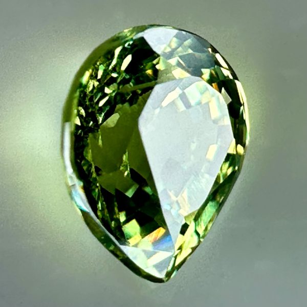 0.43 carat natural demantoid garnet from Namibia, bright green color, and excellent clarity.