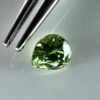 0.43 carat natural demantoid garnet from Namibia, bright green color, and excellent clarity.