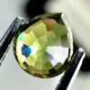 0.43 carat natural demantoid garnet from Namibia, bright green color, and excellent clarity.