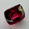 Natural cushion cut red spinel from Burma, exhibiting a rare raspberry color and excellent clarity, ideal for fine jewelry and gemstone collections.